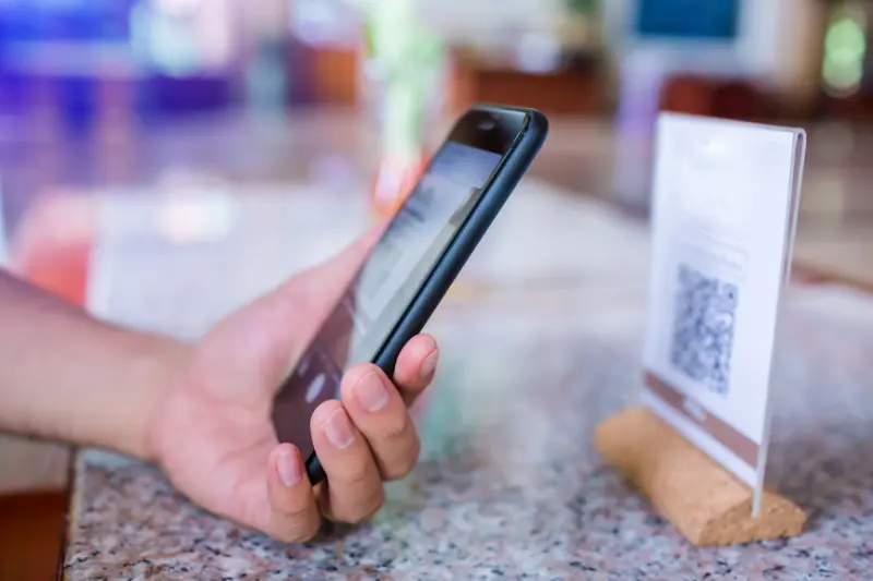 scanning a hotel QR code to leave a review