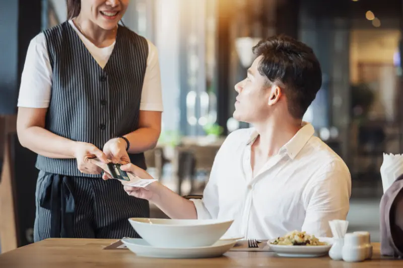 paying with credit card at a cashless restaurant